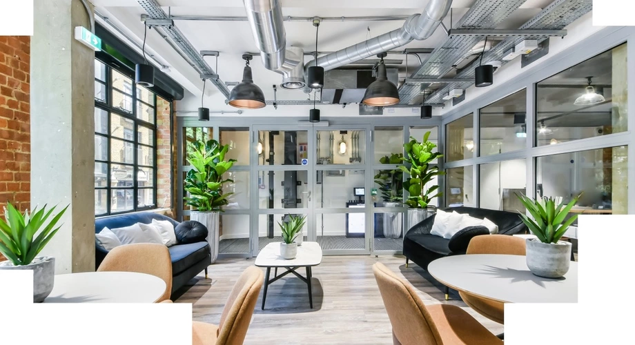 Coworking area filled with loads of green potted plants in Boutique Hoxton Square office space