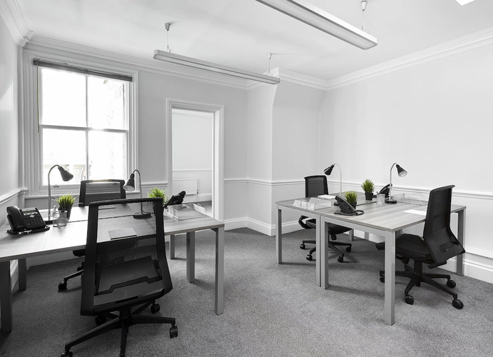 An office with black chairs.