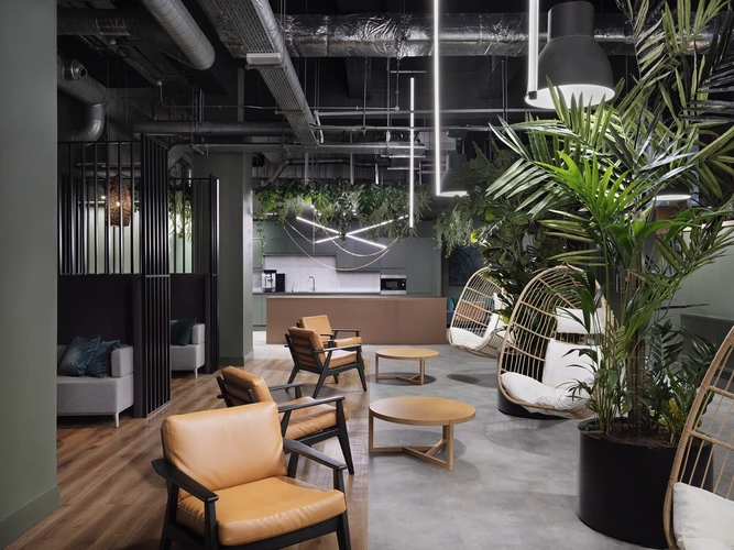Coworking space with plants and low level seating at halking paris gardens