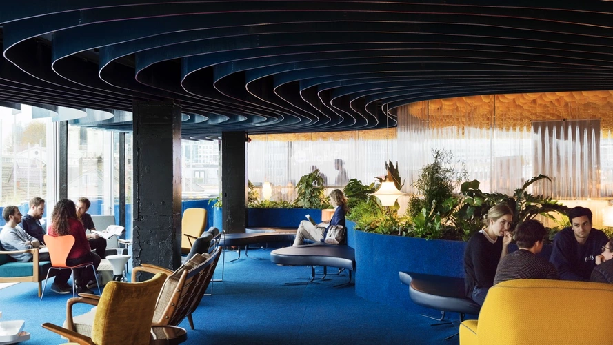 Coworking area in Second Home Spitalfields with London rooftop views on Tally Workspace