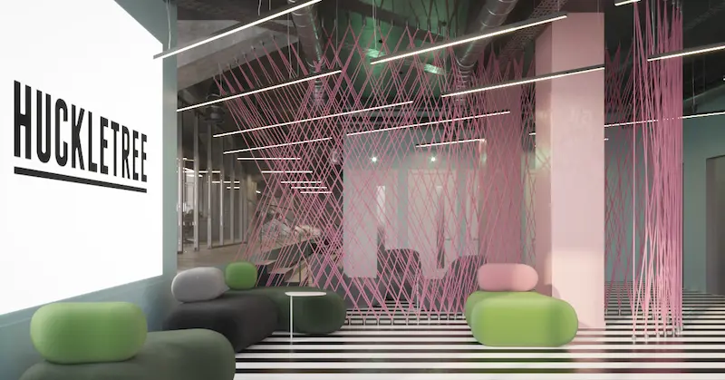 Colourful pink breakout space at Huckletree Ancoats office with pink art walls