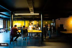 Basement coworking space with hot desk and standing table--Workspace in Tekwill Moldova available to book on demand through Tally Market.jpeg