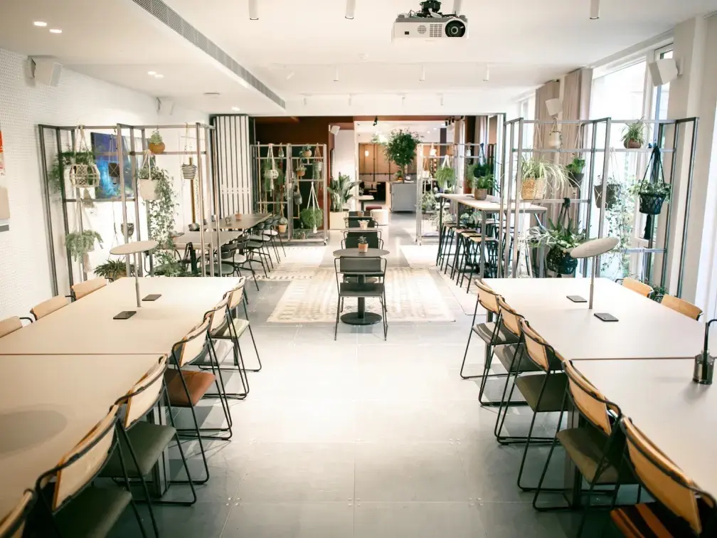 Coworking space at People's Mission Hall with two long desks for hot desking on left and right