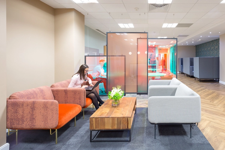 Coworking space with large sofas and seating booths at Landmark Birmingham Brindley Place