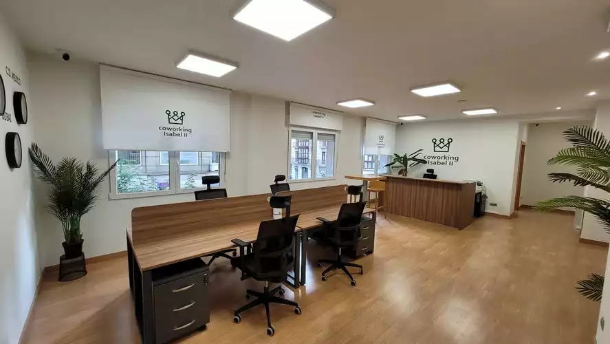 The main coworking space with desks and natural light