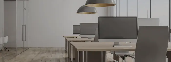The coworking area at PODZ.WORK, equipped with second screens.