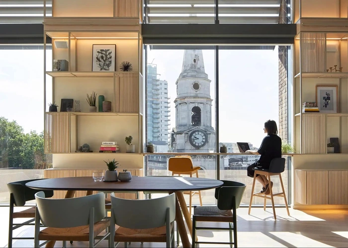 Coworking area with large windows and view at Fora Borough